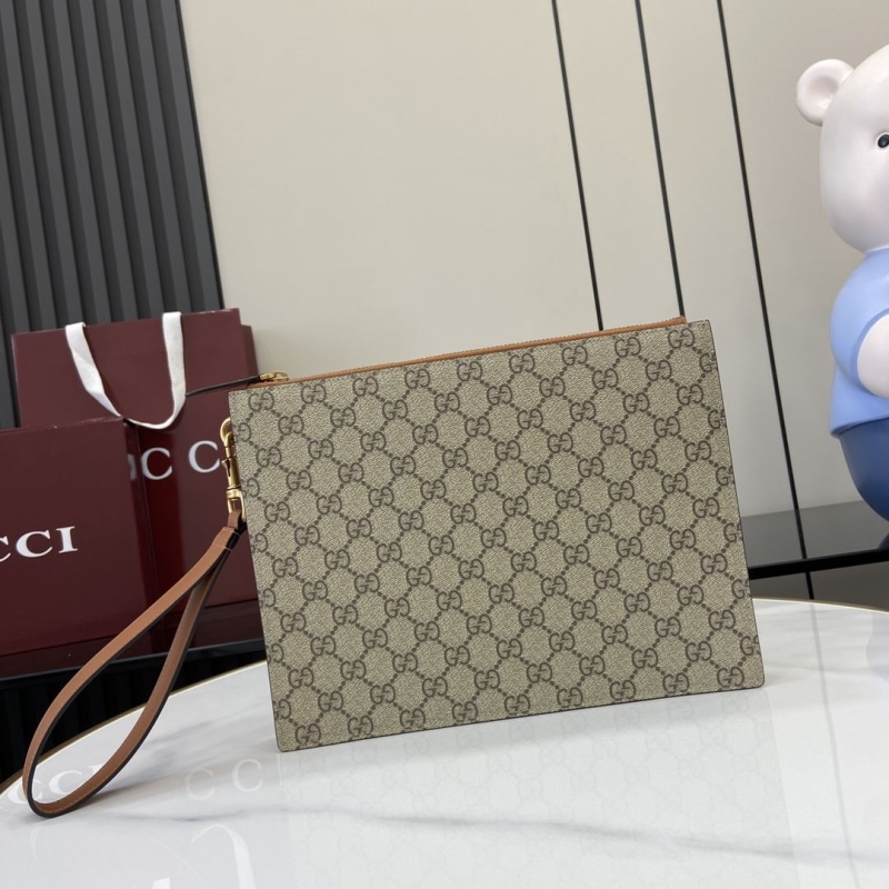 G*u*i clutch bags